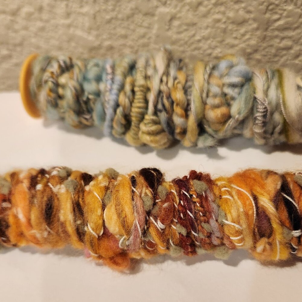 New, handmade art yarn, super soft wool. 6 yards per bobbin.